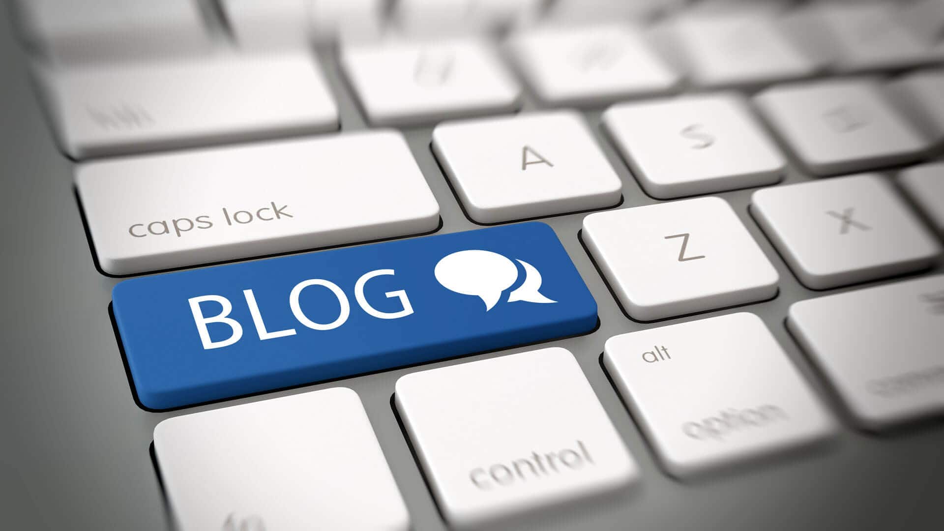 partial-computer-keyboard-with-a-blue-button-with-the-word-blog-under-the-caps-lock-button